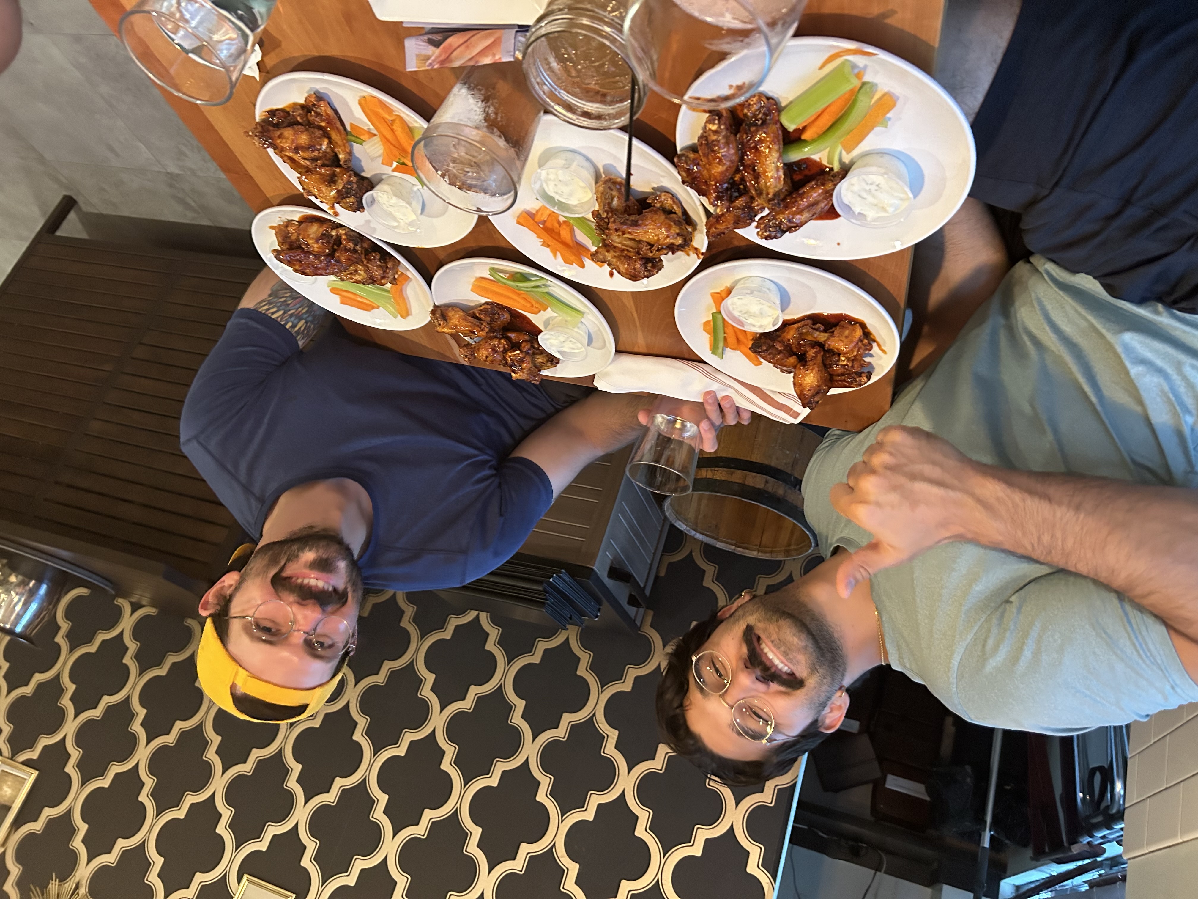 Joe and Antwon eating way too many wings at Renata's Kitchen